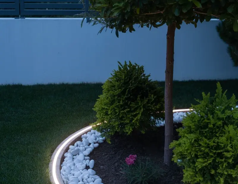 Curved Garden Bed Lighting with LED Strip & River Rocks | Nighttime Patio Ambiance