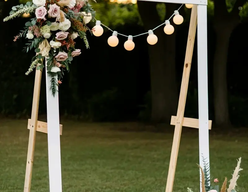 Rustic Outdoor Wedding Photo Booth Ideas | A-Frame Backdrop with Flowers & Edison Bulbs
